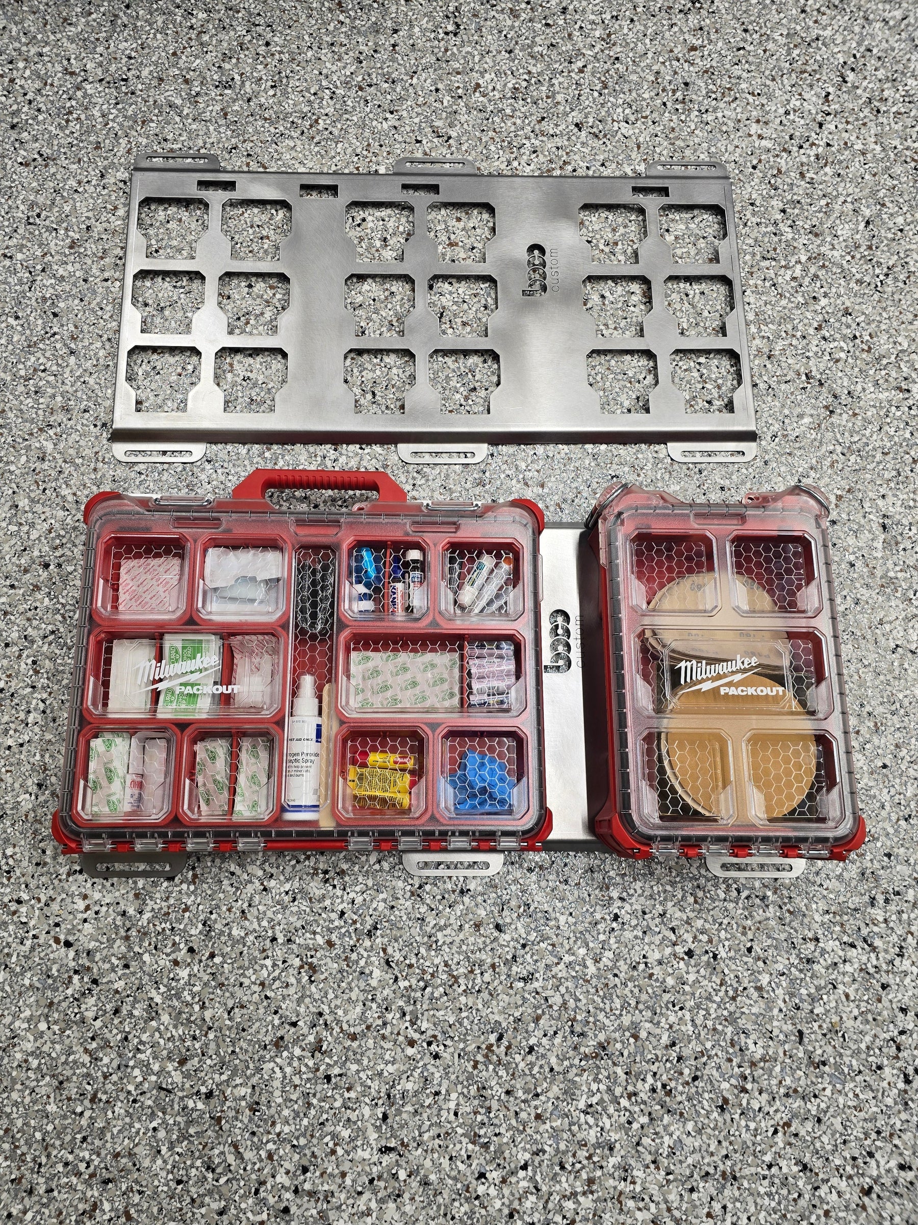 a display of a triple wide mounting bracket, bare metal, compared side by side to a mounting bracket with packout boxes attached, on a grey background