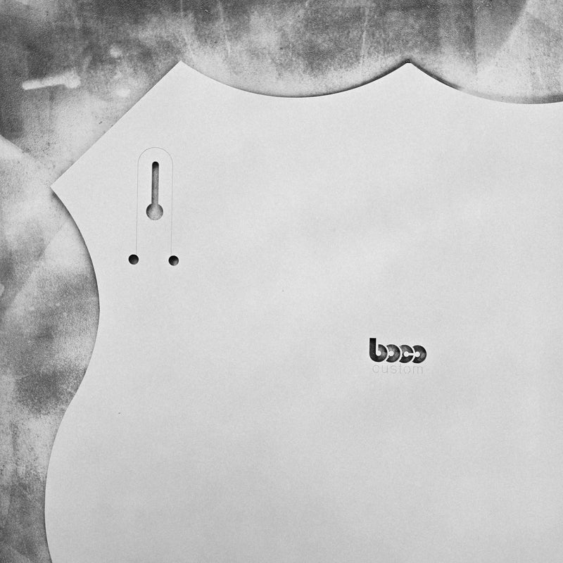 Back of the white painted Route 66 steel shield showing the keyhole hanging slot and BOCO Custom logo cutout