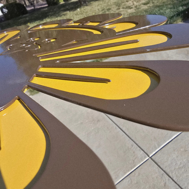 Close-up of the layered brown and yellow feathers on the BOCO Custom steel turkey lawn decor