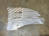 steel cutout of a tattered American flag 