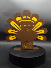 Garden art turkey, dual-layer steel lawn decor with brown and yellow powder coat, on a display stand