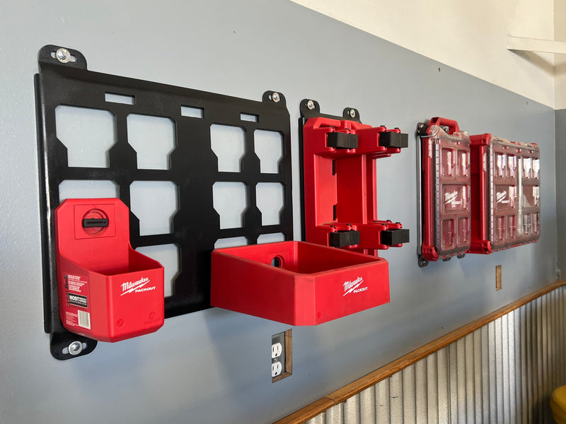 Wall-mounted tool storage organizers in red and black.