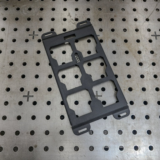 black powder-coated Milwaukee Packout steel mounting plate on a professional welding table—heavy-duty 10-gauge alternative to Milwaukee 48-22-8496 for custom shop builds.