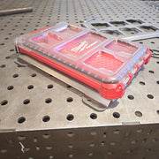 Red and clear tool organizer on metal workbench