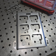 Metal bracket on a perforated metal surface