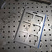 Metal mounting plate on a metal workbench