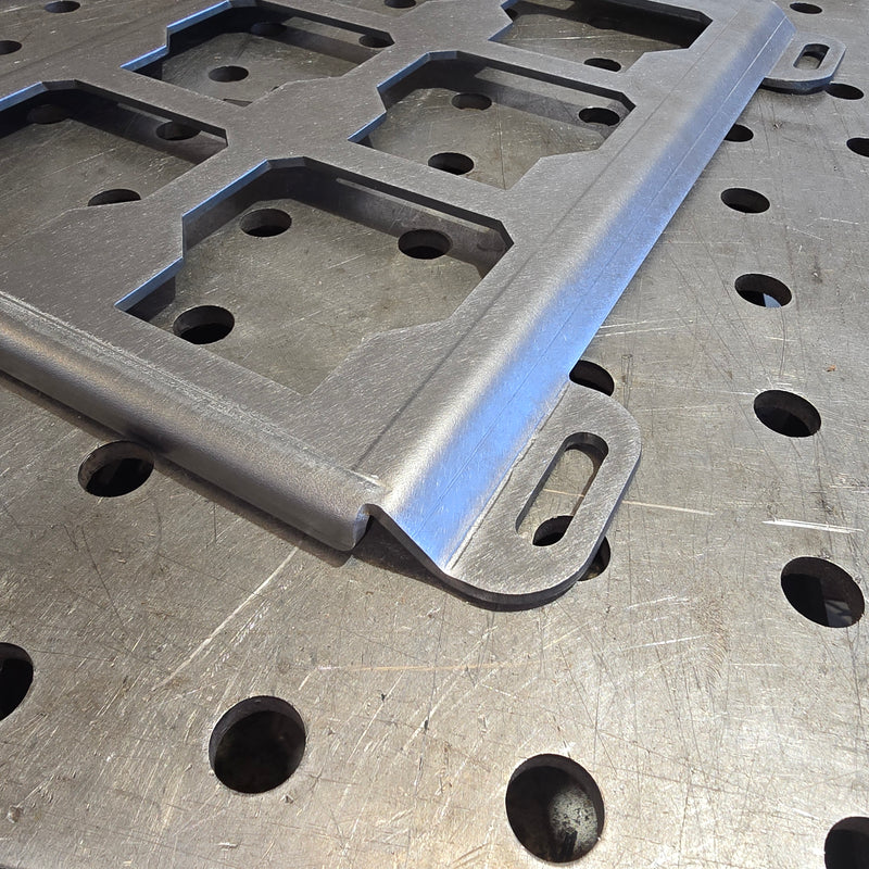 Metal bracket on a perforated metal surface