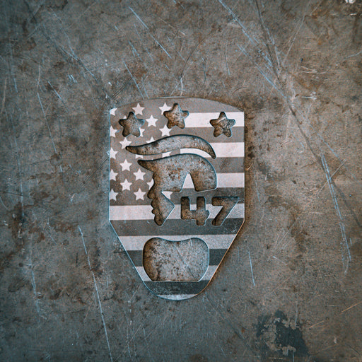 metal bottle opener with cutout of president trump and the number 47