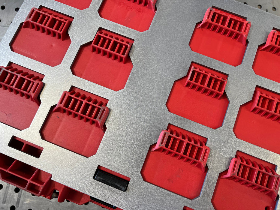 Red plastic components on a gray background