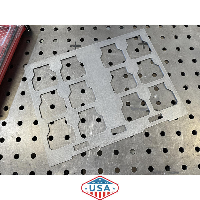 Metal template with cutouts on a perforated metal surface, featuring 'Made in the USA' label.