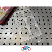 Metal template on a pegboard with 'Made in the USA' logo