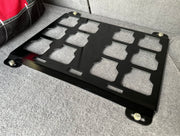 image of black mounting plate for milwaukee packout box in back of vehical