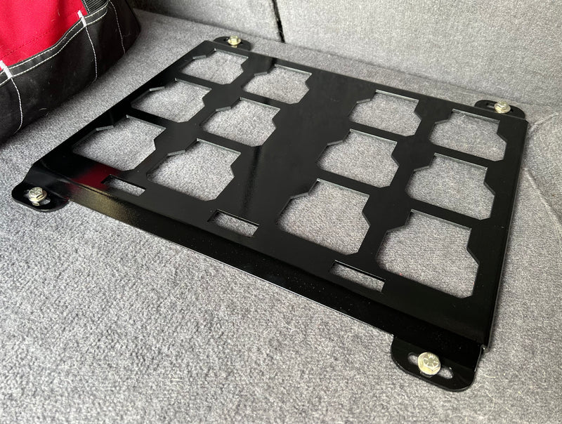 image of black mounting plate for milwaukee packout box in back of vehical