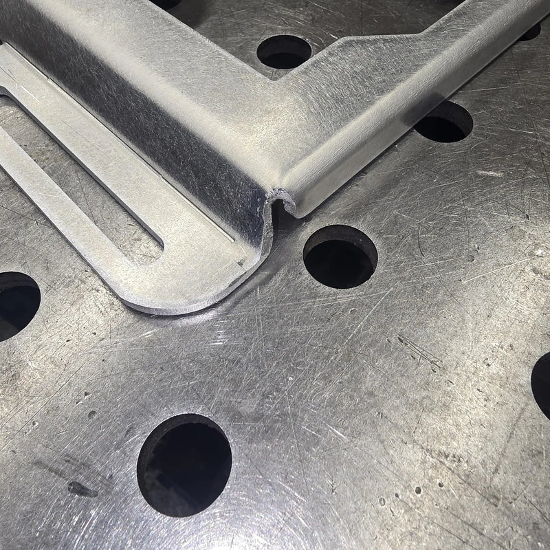 Second view of cut line imperfections near the bend on clearance aluminum mount