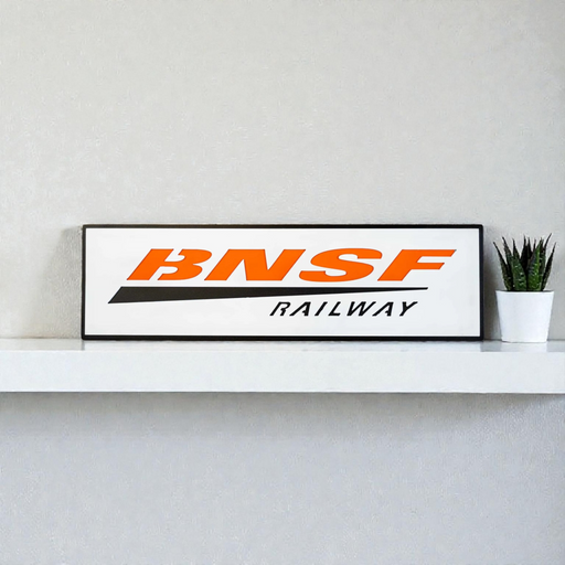 BNSF Railway metal sign displayed in a workshop—24.5-inch low profile width perfect for over-door mounting.