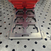 Lightweight aluminum Packout plate sitting on a mobile workstation, rust-proof solution for professional shops.