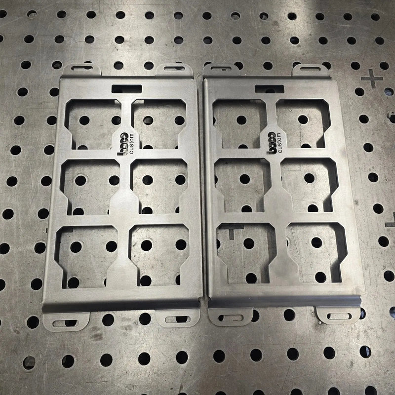 Two raw 10-gauge steel half width Packout mounting plates with BOCO Custom logo