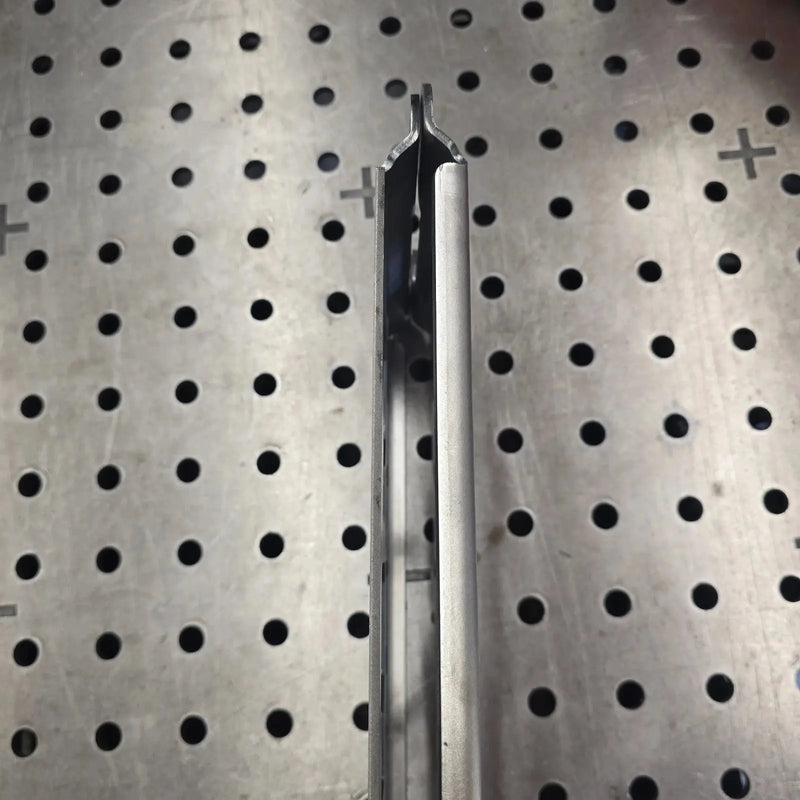 Side view of the bent edge on a 10-gauge raw steel Packout mounting plate